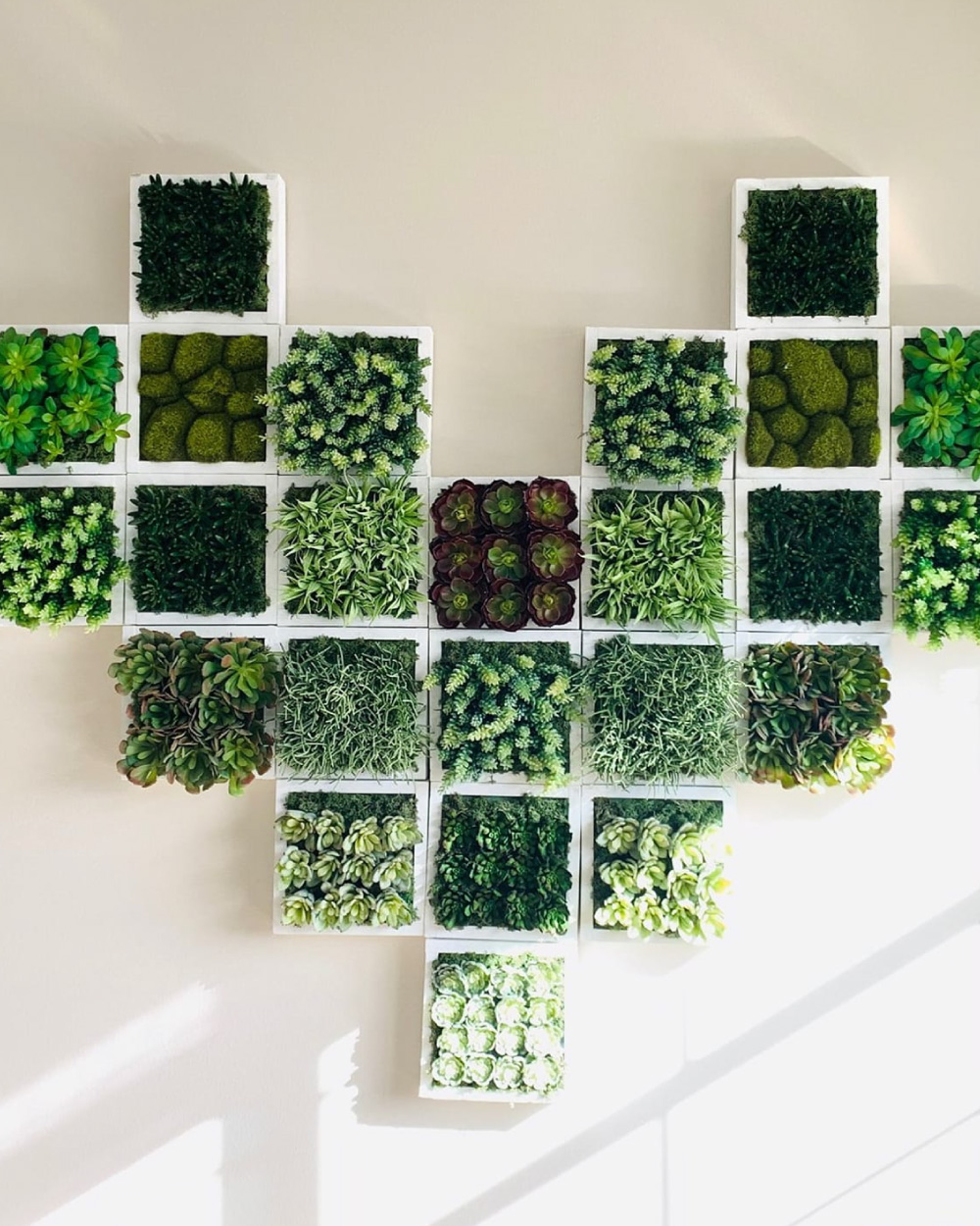 Plant wall art in the shape of a heart